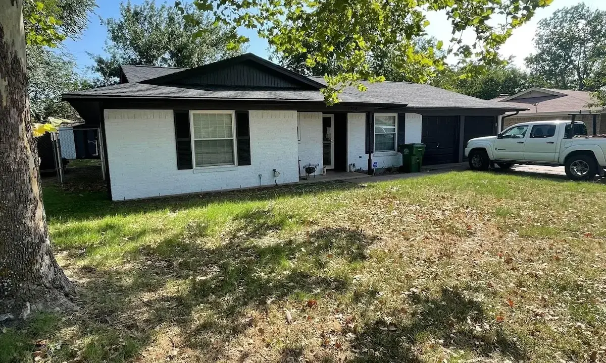 Professional roofing crew working on a residential roof in Caribou